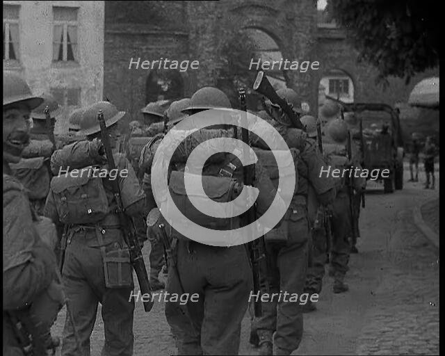 British Soldiers Marching Through a French Town, 1940. Creator: British Pathe Ltd.
