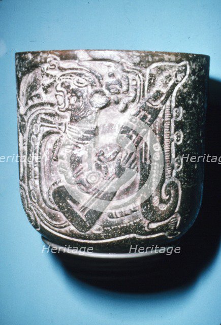 Mayan Pot of Man in high animal head-dress holding staff with lotus flower. Artist: Unknown.
