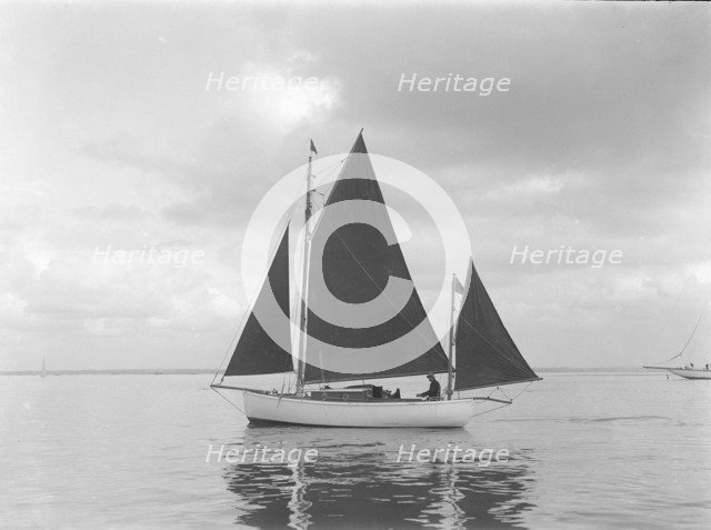 The 4 ton yawl 'Mandy' under sail, 1922. Creator: Kirk & Sons of Cowes.