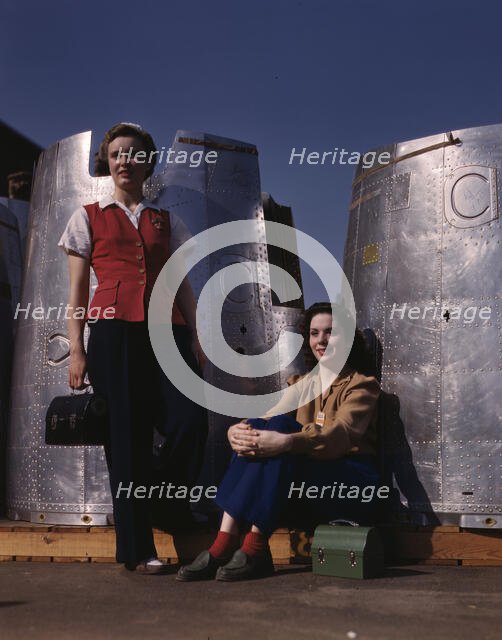 Two assembly line workers at the Long Beach, Calif., plant of Douglas Aircraft Company..., 1942. Creator: Alfred T Palmer.