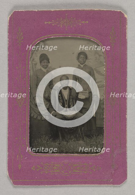 Tintype photograph of a man identified as James Turner, with two women, ca. 1873. Creator: H.G. Pearce.