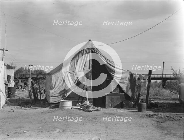 Home of a family of native Californians, migratory workers, Near Porterville, California, 1936. Creator: Dorothea Lange.