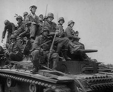 German Soldiers Riding Tanks, 1941. Creator: British Pathe Ltd.