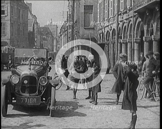Male British Civilian Driving a Car Executing a Turning Manoeuvre On the Streets of London..., 1920s Creator: British Pathe Ltd.