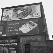 Advertising hoardings, Fortnam Road, Holloway, London, 1960-1965. Artist: John Gay