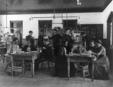 Chemistry classroom at Hampton Institute - African American male and female students, 1899 or 1900. Creator: Frances Benjamin Johnston.