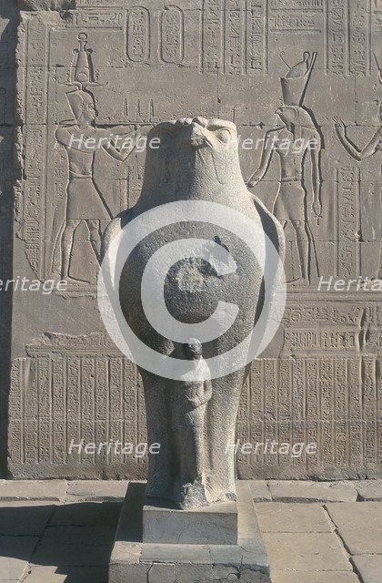 Giant statue of the Ancient Egyptian falcon-headed god Horus, Edfu, Egypt. Artist: Unknown