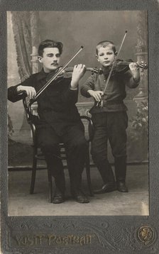 P.L. Stolyarov and V.P. Karetnikov playing violins, 1910-1919. Creator: I. F. Varlekhovskii.