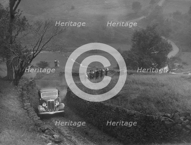 Ford V8 saloon of F Allott competing in the MCC Sporting Trial, 1935. Artist: Bill Brunell.