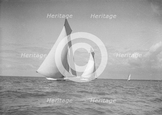 The 19-metre class 'Mariquita' & 'Corona' race downwind under spinnaker, 1911. Creator: Kirk & Sons of Cowes.