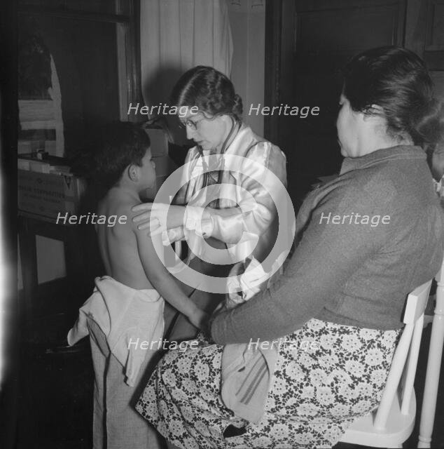 Visiting public health doctor conducts well-baby clinic..., Calipatria, Imperial Valley, 1939. Creator: Dorothea Lange.