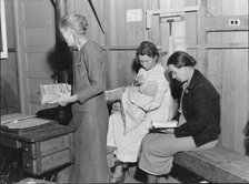 Hymn singing at meeting of Mothers' Club in Arvin migrant camp, California, 1938. Creator: Dorothea Lange.