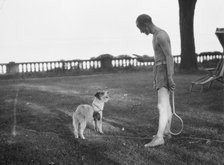 Cosgrave, Mr., with dog, outdoors, not before 1917. Creator: Arnold Genthe.