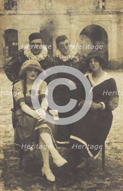 Members of 'The Stars' concert party, two soldiers in drag and two as pierrots, pose around..., 1919 Creator: Unknown.