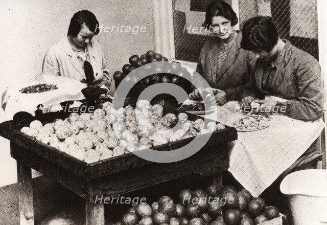 Women peeling lemons for the manufacture of Cloudy Lemon Squash, 1923. Artist: Unknown