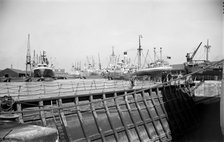Shipping in the East Branch Dock at Tilbury, Essex, c1945-c1965. Artist: SW Rawlings