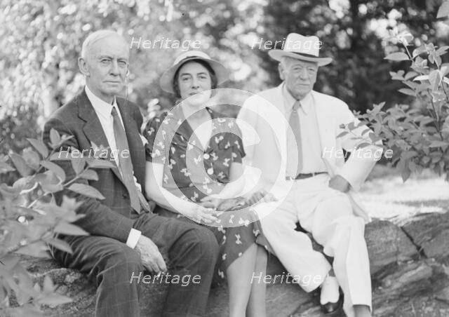 Timken, W.R., Mr. and Mrs., and John Hemming Fry, seated outdoors, 1938 July. Creator: Arnold Genthe.