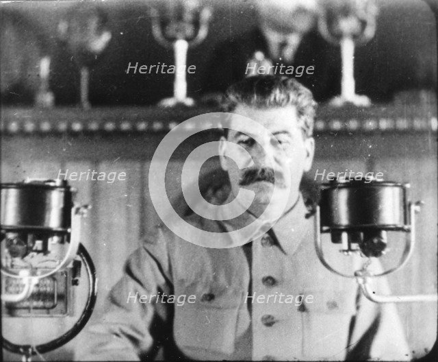 Soviet leader Josef Stalin giving a speech at the Congress of the Communist Party, 1930s. Artist: Unknown
