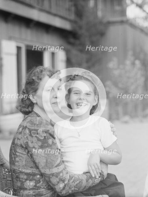 Mrs. Churchill with child Orrin, seated outdoors, not before 1932 Mar. Creator: Arnold Genthe.