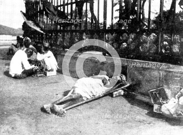 Scenes in Plague-Stricken Bombay: a wayside case, 1898. Creator: Gysi.