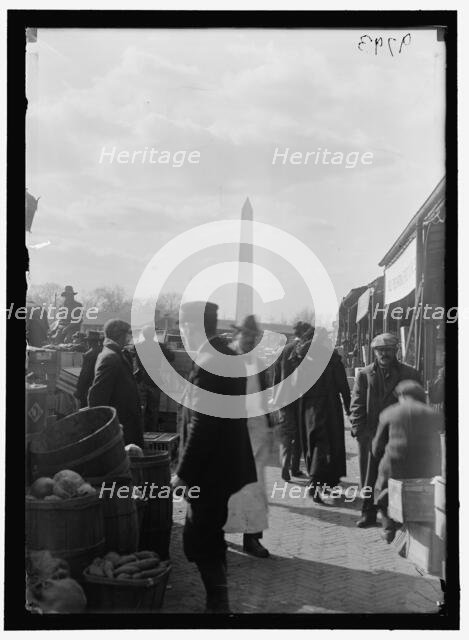 Market; Washington Monument in background, between 1916 and 1918. Creator: Harris & Ewing.