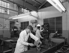 Apprentice at work, Globe & Simpson auto electrical workshop, Nottingham, Nottinghamshire, 1961. Artist: Michael Walters