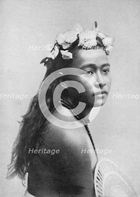 A Samoan girl, with chaplet of hibiscus flowers, 1902. Artist: Thomas Andrew.