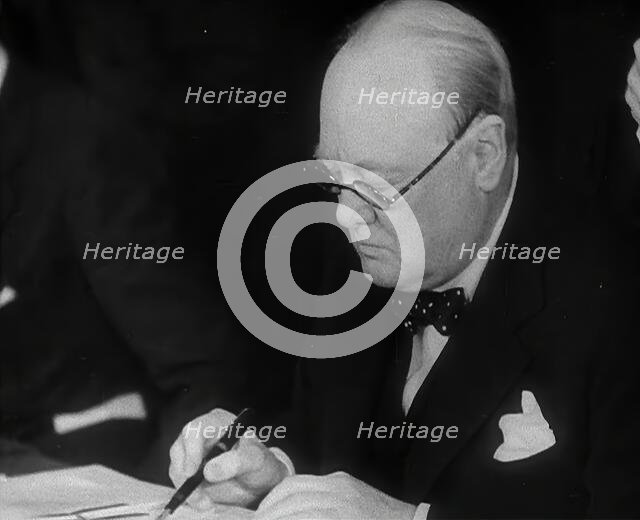 Winston Churchill Signing an Agreement Allowing the USA to use British Naval Bases in..., 1941. Creator: British Pathe Ltd.