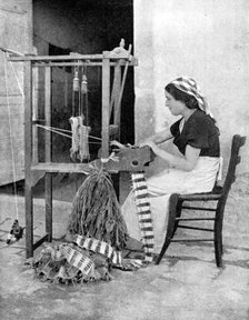 Woman weaving with straw on a hand loom, Fiesole, near Florence, Italy, 1936. Artist: Donald McLeish
