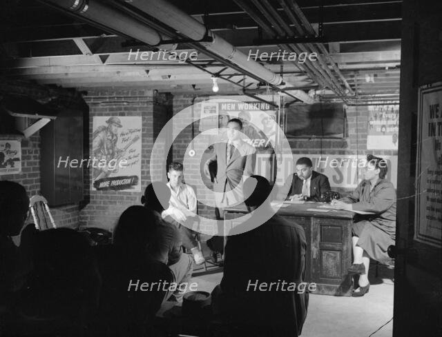 Air raid wardens' meeting in zone nine, Southwest area, Washington, D.C, 1942. Creator: Gordon Parks.