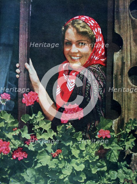 Young German woman at a window, 1943. Artist: Unknown