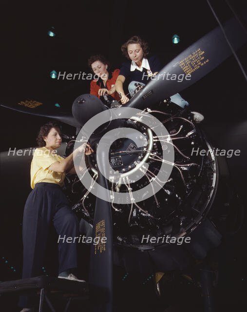 Women at work on C-47 Douglas cargo transport, Douglas Aircraft Company, Long Beach, Calif., 1942. Creator: Alfred T Palmer.