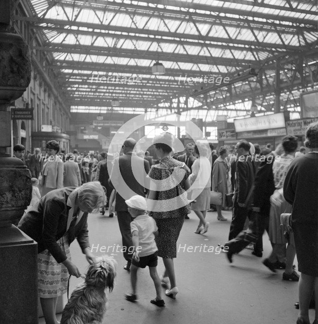 Passengers at Waterloo Station, London, 1962-1964. Artist: John Gay