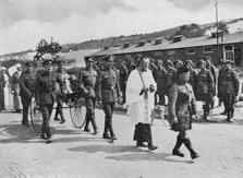 Army chaplain officiating at funeral of nurse killed in air raid on British base near Etables, 1918. Artist: Unknown