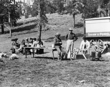 Tourists and guides picnicking in Yellowstone Park, 1903. Creator: Frances Benjamin Johnston.