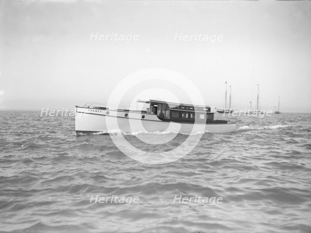 The motor launch 'Cygnet' under way, 1912. Creator: Kirk & Sons of Cowes.