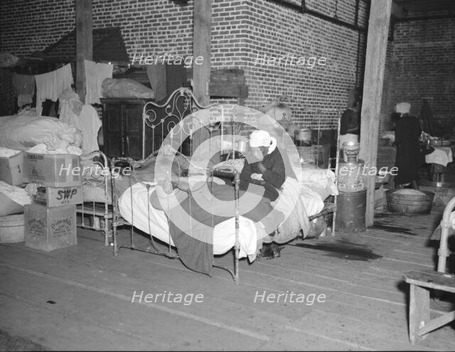 Sick flood refugee in the Red Cross temporary infirmary at Forrest City, Arkansas, 1937. Creator: Walker Evans.