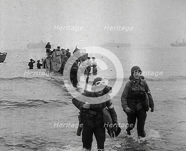 American Troops Walking Onto a North African Beach as Part of 'Operation Torch', 1942. Creator: British Pathe Ltd.