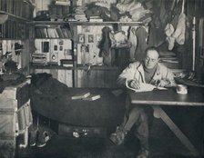 'Captain Scott Writing His Diary in the Hut at Cape Evans', c1911, (1914). Creator: Herbert Ponting.