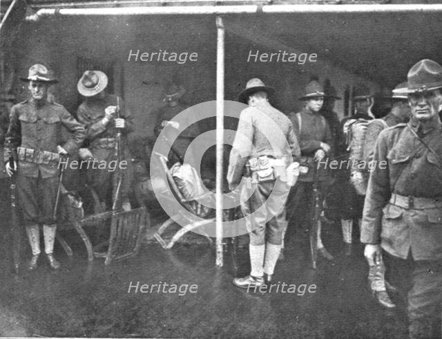 'Les Premiers Contingents Americains en France; A bord d'un transport: soldats se preparent..., 1917 Creator: Unknown.