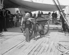 U.S.S. New York, Admiral Sampson's son and Pitch the mascot, between 1893 and 1901. Creator: William H. Jackson.