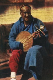 Travelling musician, China, c1928. Creator: Unknown.