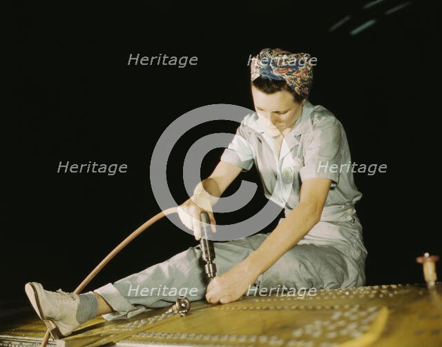 Drilling on a Liberator Bomber, Consolidated Aircraft Corp., Fort Worth, Texas, 1942. Creator: Howard Hollem.