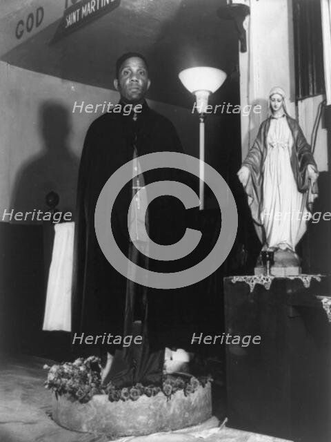 Reverend Vondell Gassaway, pastor of the St. Martin's Spiritual Church..., Washington, D.C., 1942. Creator: Gordon Parks.