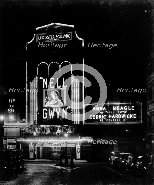 Night view of the Leicester Square theatre, London, c1930. Artist: Larkin