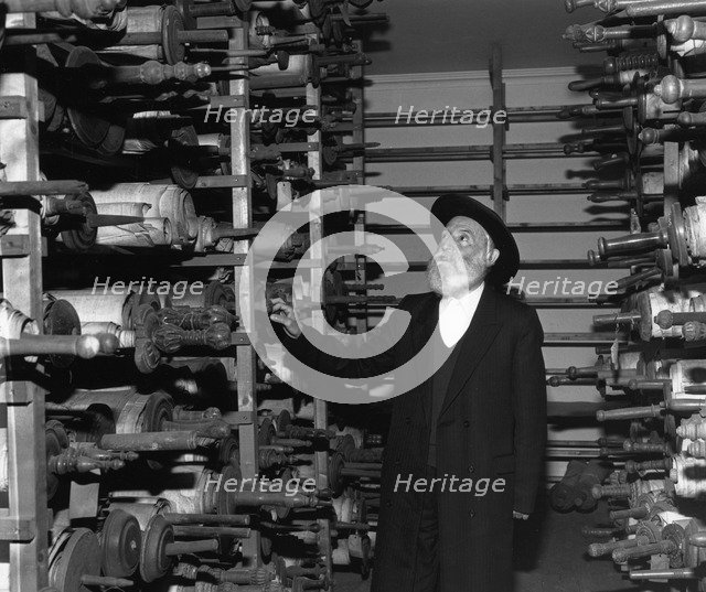 Dr David Brand, Scribe, at Westminster Synagogue, London, 1988. Artist: Sidney Harris