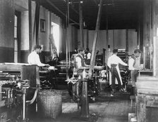 Pressmen at work in printing shop, Hampton Institute, Hampton, Virginia, 1899 or1900. Creator: Frances Benjamin Johnston.