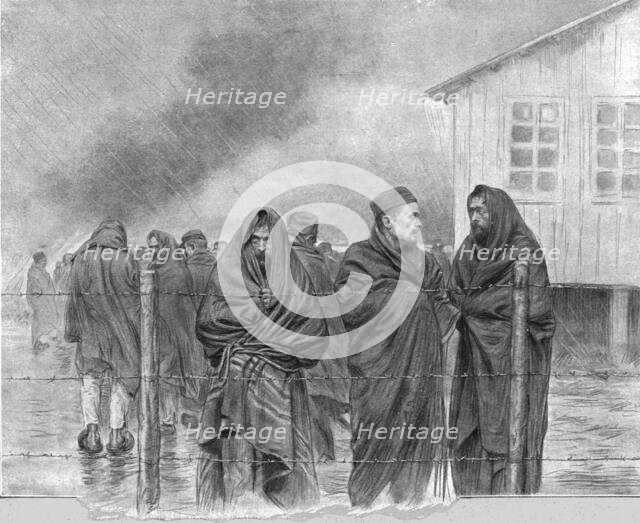 'La vie de nos prisonniers; au meme camp: convalescents, enveloppes dans des couvertures.... Creator: Unknown.