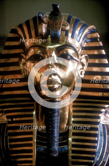 Gold mask of Tutankhamun on his mummy-case. Artist: Unknown
