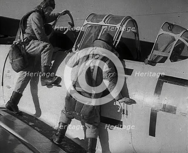 British Pilots Entering a Fighter Plane, 1941. Creator: British Pathe Ltd.
